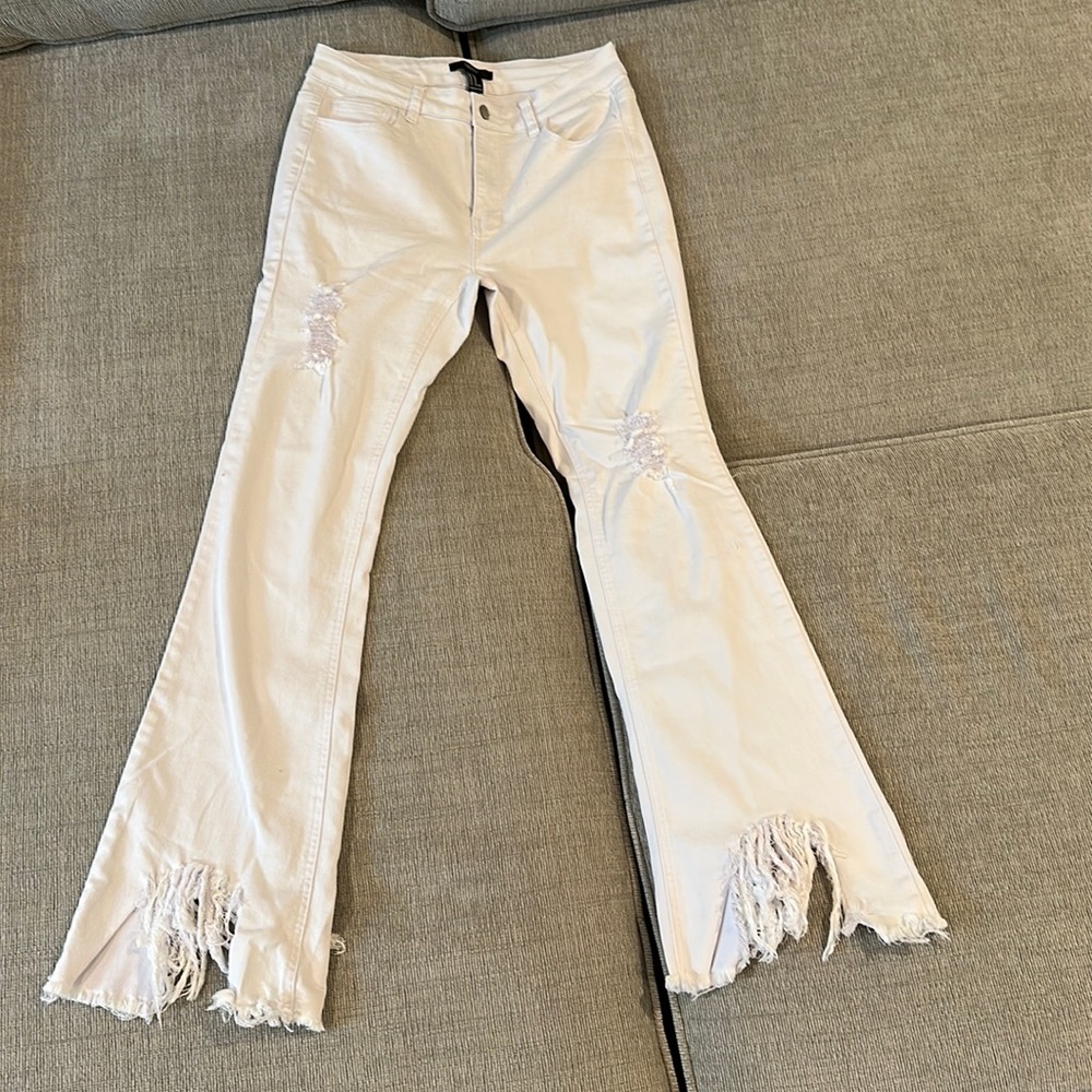 White bell bottom ripped jeans